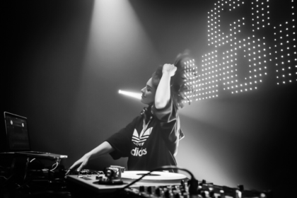 A female DJ artist performing during a music event