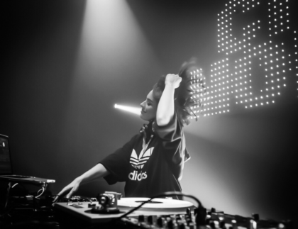 A female DJ artist performing during a music event
